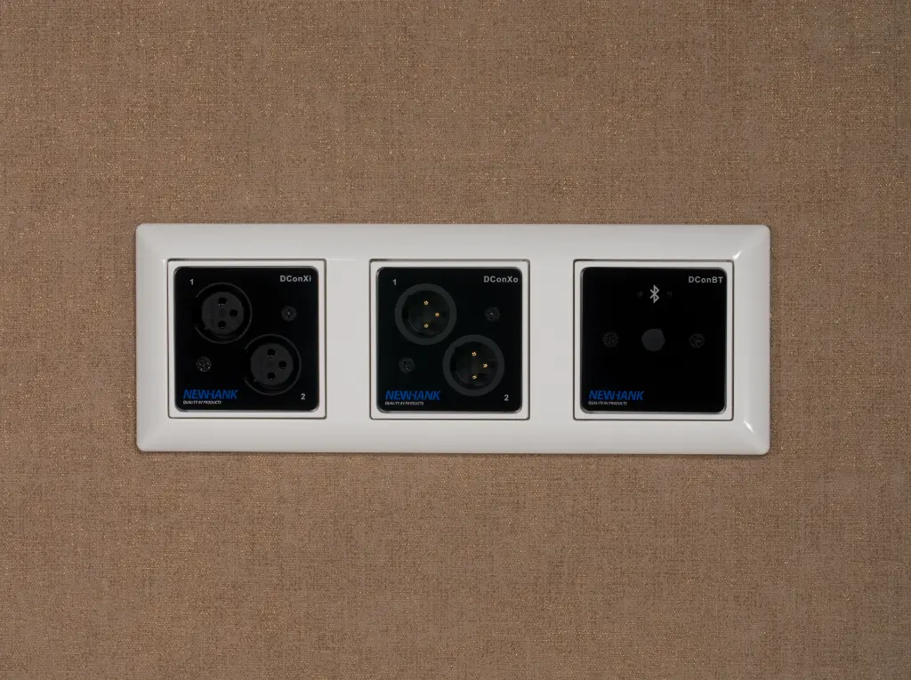 DCon_On_Brown_Wall.webp