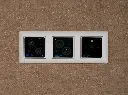 DCon_On_Brown_Wall.webp